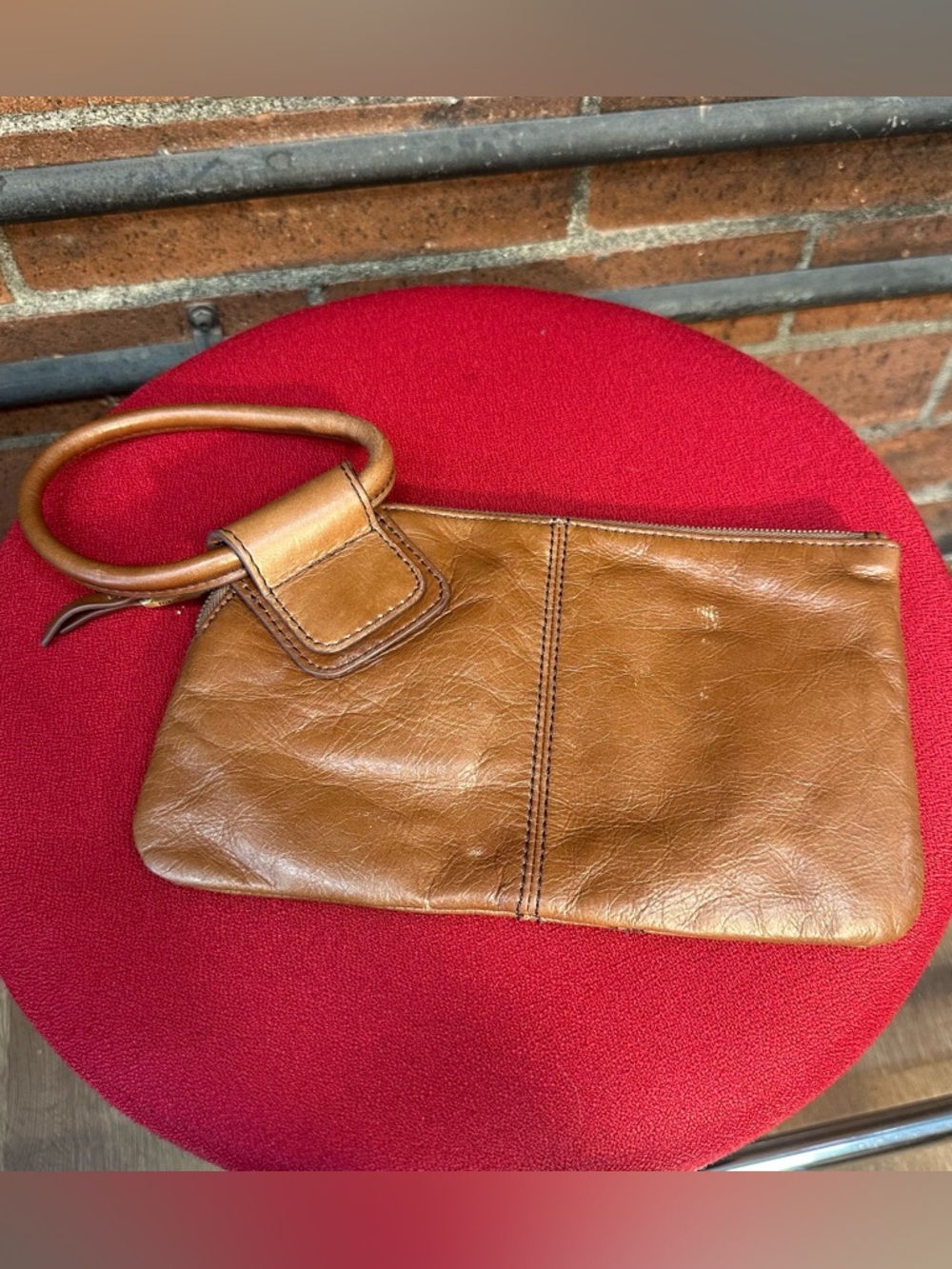 Leather Wristlet Clutch in Tan by Hobo